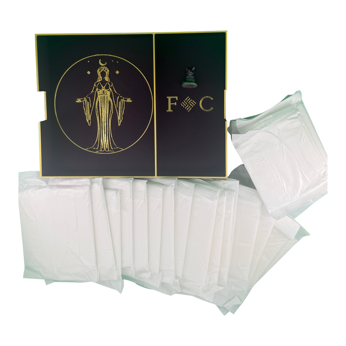 The Fortune Coochi box open to show the gold goddess emblem and F C monogram, with individually wrapped organic pads and liners spread out in front.